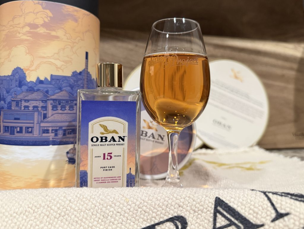Sample vial of Oban 15 next to whiskey snifter