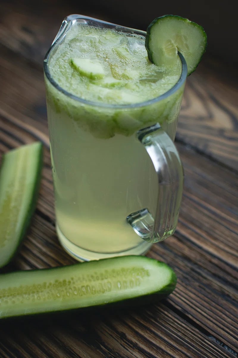 A pitcher full of cucumber lime beer cocktail mix