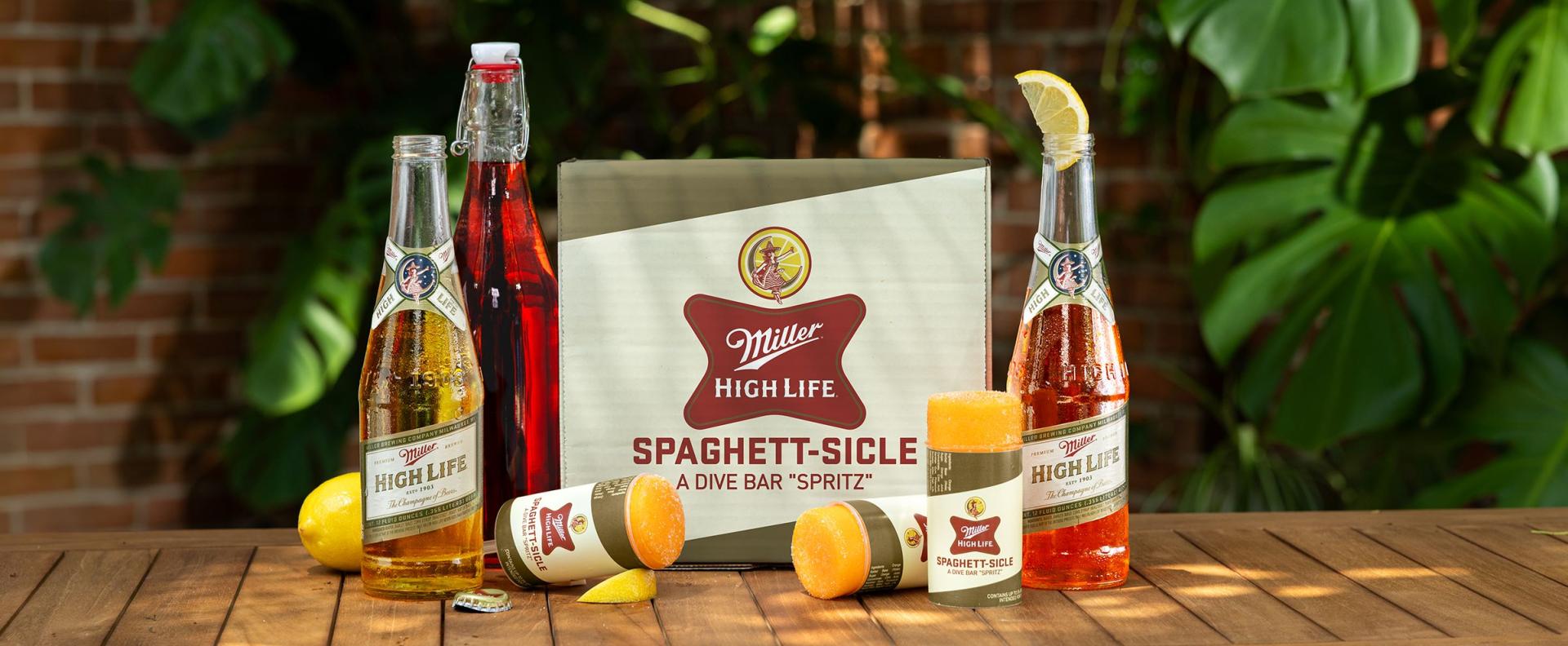 A Spaghett beer cocktail next to a case of Miller High Life
