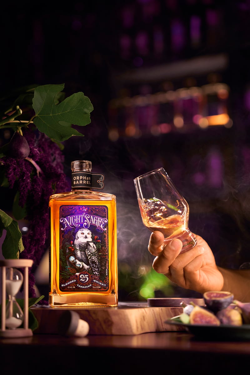 A bottle and glasses of Night Sage whisky
