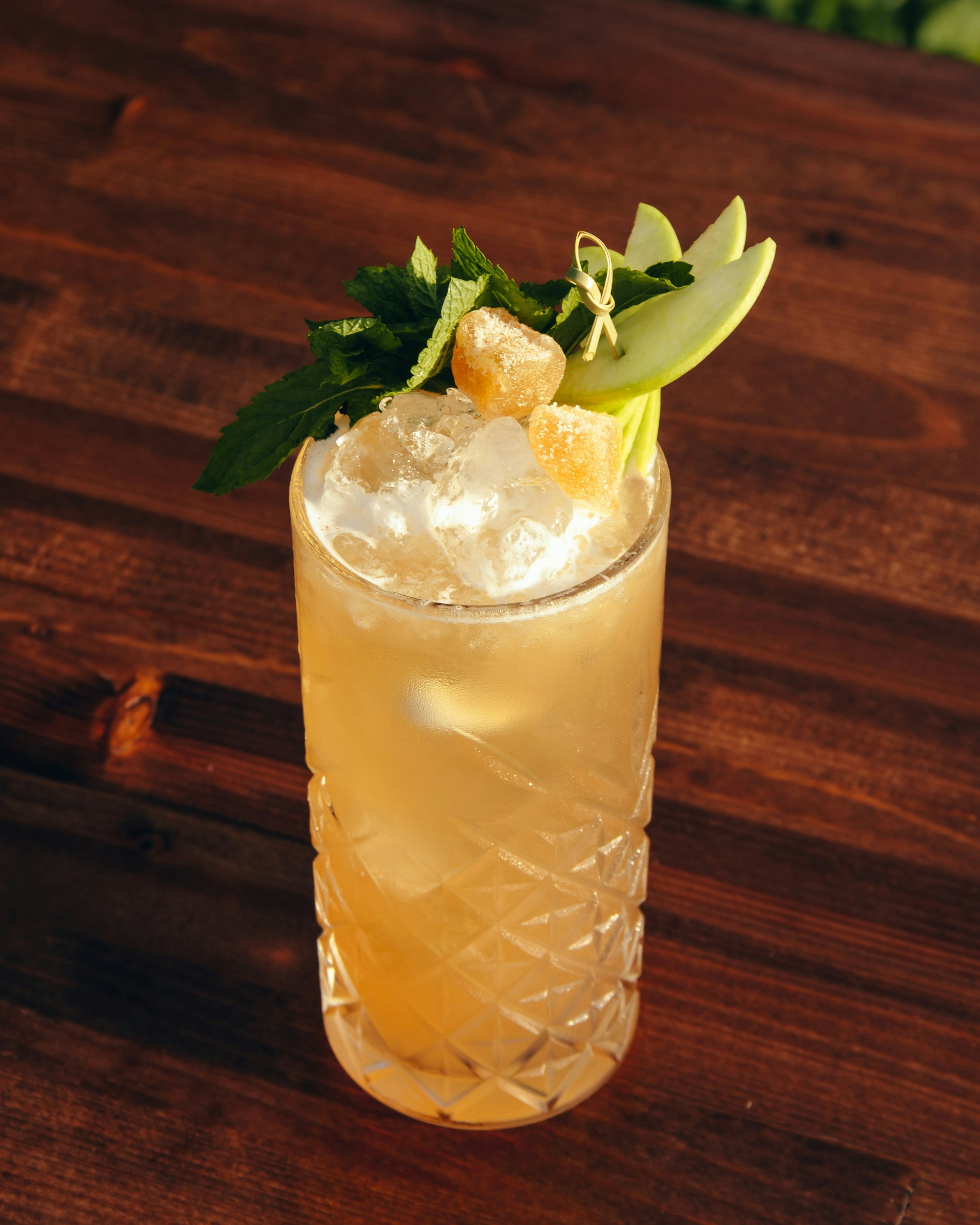 A kentucky mule in a class with mint and apple garnish