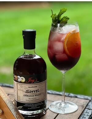 A bottle and glass of Sorrel Elixir
